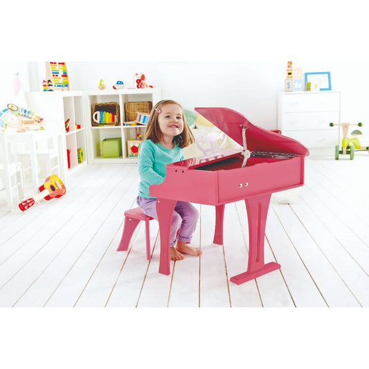 Hape Happy Grand Piano pink toy piano for kids, available at the best toy shop in Qatar with reliable toy delivery service.
