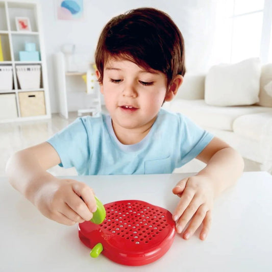 Best toy shop in Qatar,child playing with Hape Magnetic Drawing Board, a fun and educational toy, available at the best online toy shop in Qatar with reliable toy delivery service