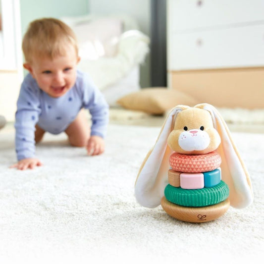 Best toy shop in Qatar – Hape Bunny Stacker toy set with wooden rings and bunny head in a natural playroom setup, buy kids toys online in Qatar from the best online toy shop with toy delivery service in Qatar.