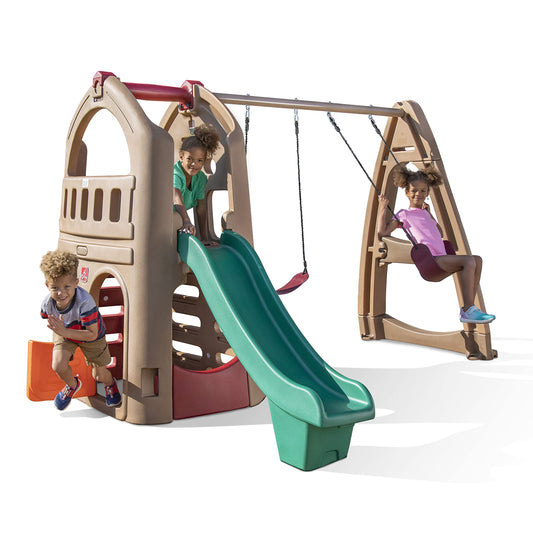 kids outdoor playhouse Qatar -Children playing on a playground set with a slide and swing.