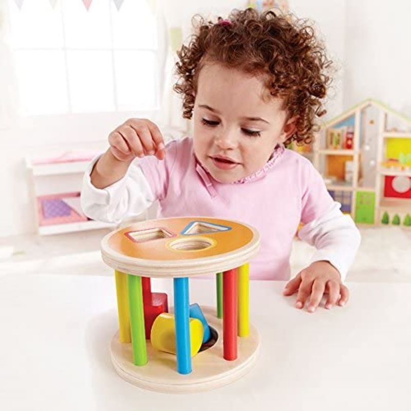 Best toy shop in Qatar – toddler playing with Hape 1-2-3 Shape Sorter, learning colors and shapes, available to buy kids toys online in Qatar from the best online toy shop with toy delivery service in Qatar.