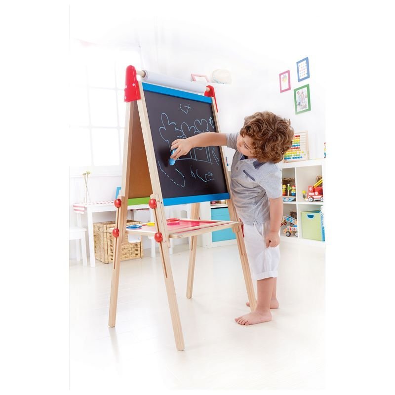 Best toy shop in Qatar – child drawing on Hape All-in-1 Easel magnetic whiteboard and chalkboard, available to buy kids toys online in Qatar from the best online toy shop with toy delivery service in Qatar.