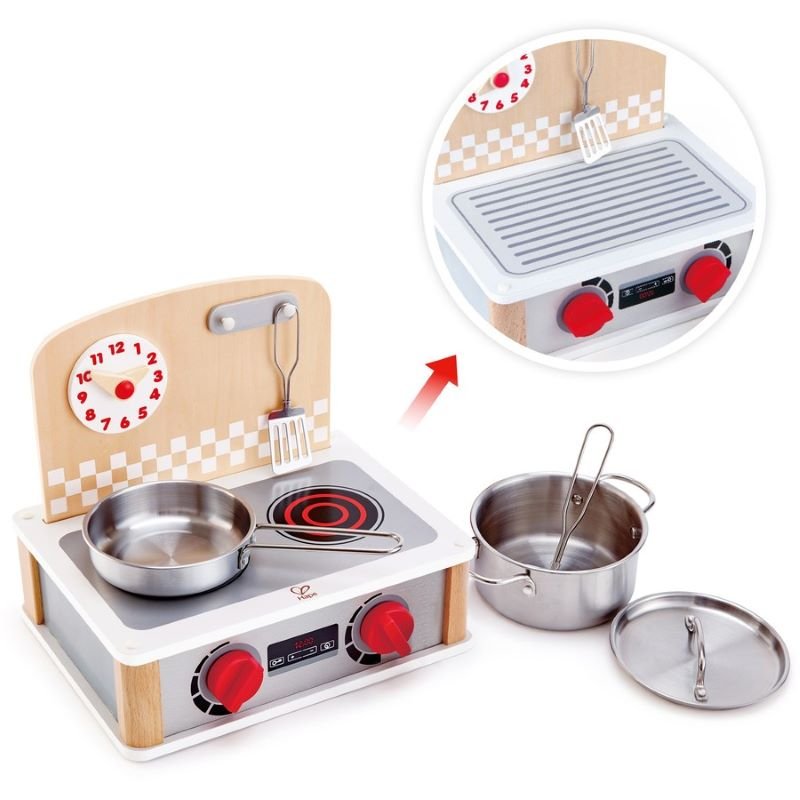 Best toy shop in Qatar – close-up of flipping hotplates and hidden grill in Hape 2 In 1 Kitchen & Grill Set, perfect to buy kids toys online in Qatar from the best online toy shop with toy delivery service in Qatar.