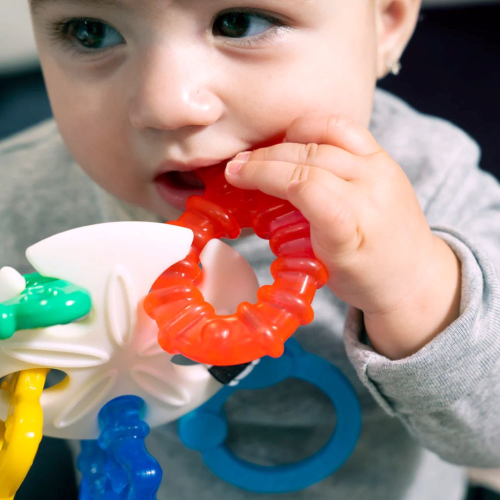 Baby playing with Baby Einstein teether set – best online toy shop in Qatar