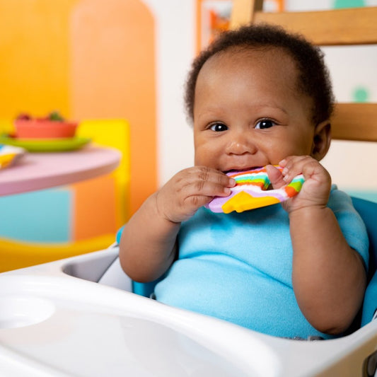 Kids playing with Bright Starts Soothing Soft Serve Silicone Teether – best toy shop in Qatar, buy kids toys online in Qatar