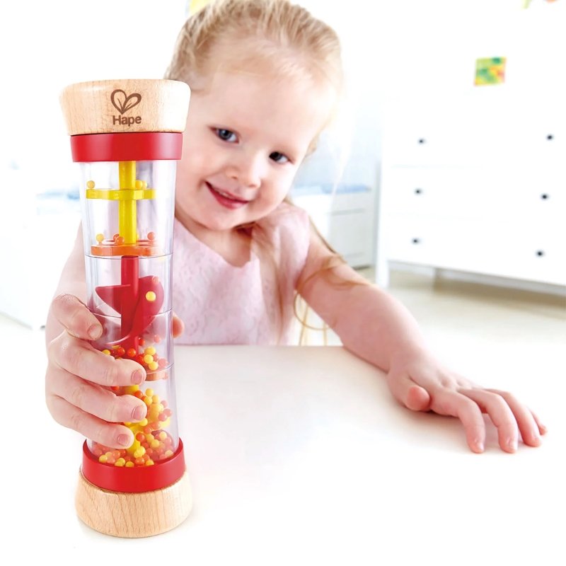 baby playing with Hape Beaded Raindrops Red sensory toy, available to buy kids toys online in Qatar from the best online toy shop with fast toy delivery service in Qatar.