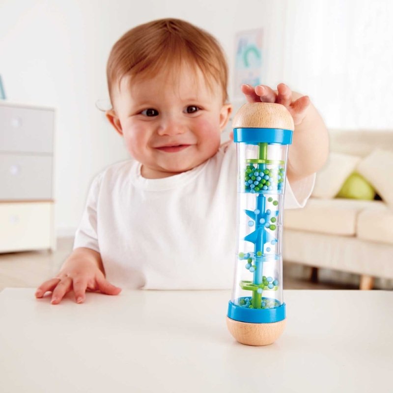 Best toy shop in Qatar – baby playing with Hape Beaded Raindrops Blue sensory rattle, buy kids toys online in Qatar from the best online toy shop with fast toy delivery service in Qatar.